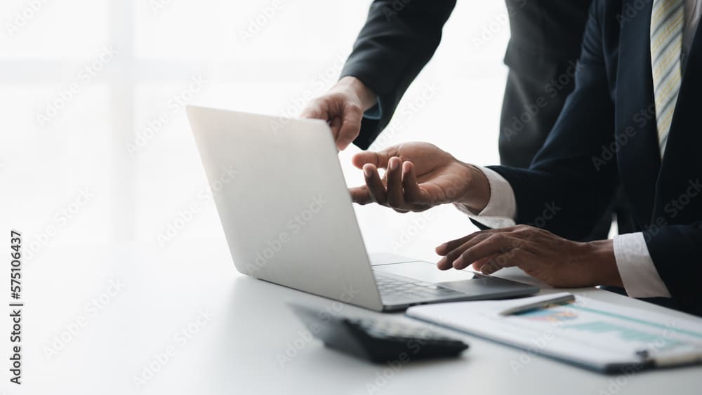 The sales department is having a monthly summary meeting to bring it to the department manager, they are verifying the correctness of the documents that are prepared before bringing in to the manager